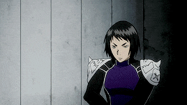 a cartoon character is standing in front of a wooden wall
