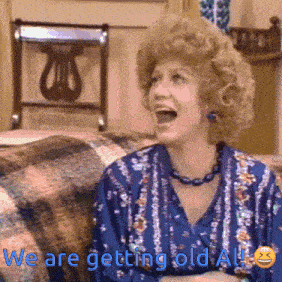 a woman sitting on a couch with her mouth open and the words we are getting old all