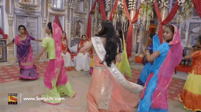 a group of people are dancing in a room with a sony liv logo on the bottom right