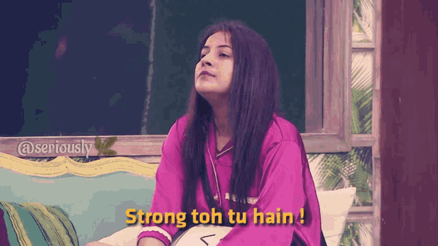 a woman sitting on a couch with the words strong toh tu hain on the bottom