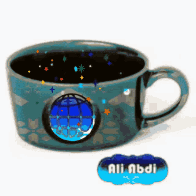 a blue cup with a blue globe on it and the name ali abdi below it