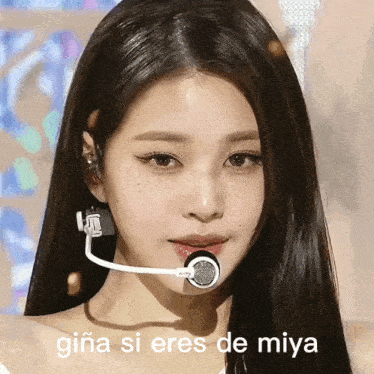a close up of a woman 's face with the words gina si eres de miya
