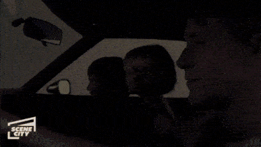 a scene city ad shows a man driving a car with a woman and a boy