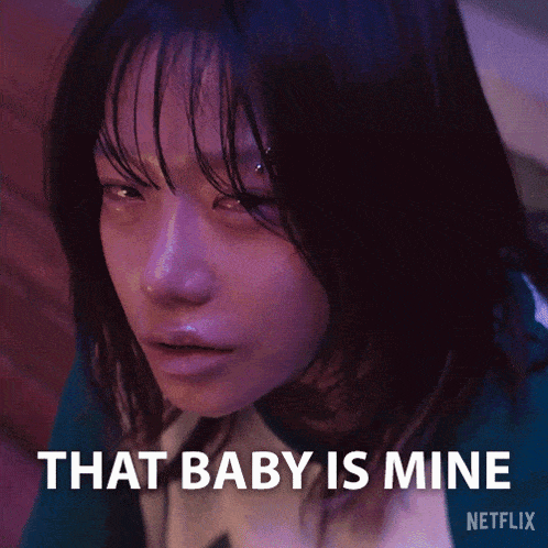 a close up of a woman 's face with the words that baby is mine written below her