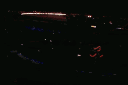 an aerial view of a baseball stadium with a budweiser banner