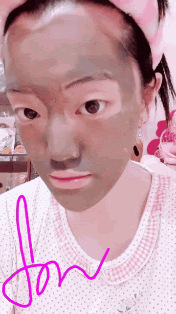 a woman with a mask on her face has the word jon written on the bottom
