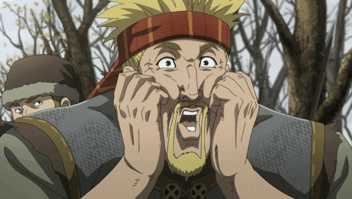 a man with a scarf around his head has his mouth open