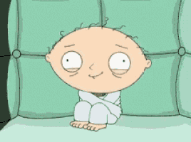 a cartoon character is sitting on a couch wrapped in a blanket