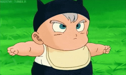 a baby is wearing a bib and a black hat with cat ears