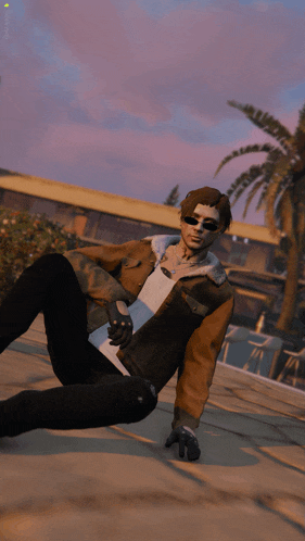 a man wearing sunglasses and a brown jacket laying on the ground
