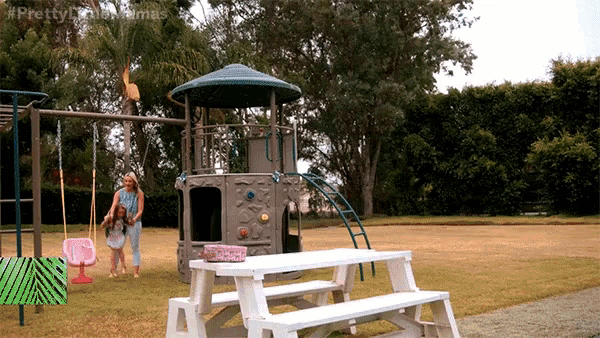 a woman and child are playing in a playground with the hashtag #prettylittlemamas on the bottom