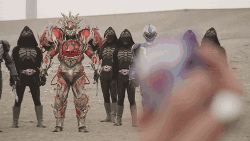 a group of skeletons are standing in a desert