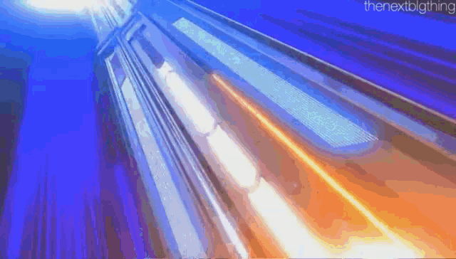 a computer generated image of a building with a blue sky in the background