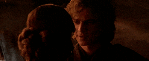 a man and a woman are looking into each other 's eyes