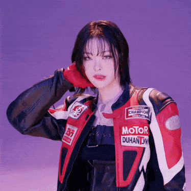 a woman wearing a jacket that says motor duhan