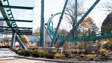 a roller coaster is under construction in a park