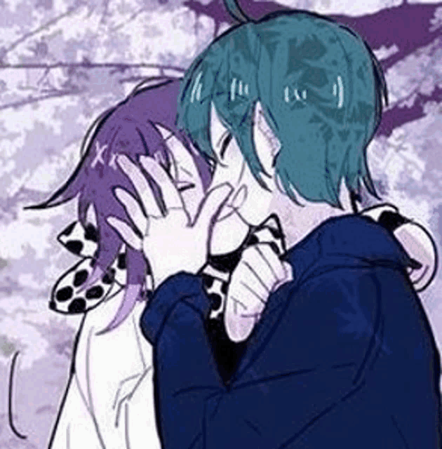 a couple of anime characters are hugging each other and kissing each other .