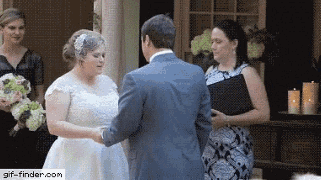 a bride and groom are getting married with a gif-finder.com watermark on the bottom
