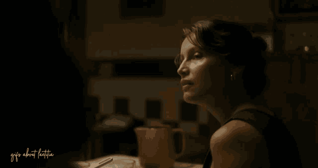 a woman sits at a table with a pitcher of coffee and the words girls about coffee written on the bottom