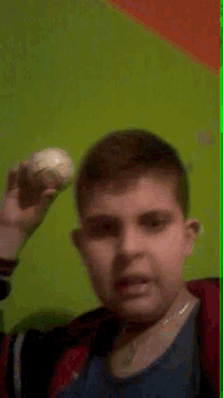 a blurry picture of a man 's face with a ball on his head
