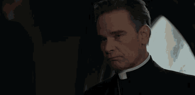 a priest is talking to another man in a car and says are you done .