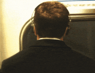 a blurry picture of a man standing in a hallway