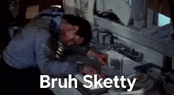 a man is sitting at a kitchen counter with his head in a sink and a caption that says bruh sketty .