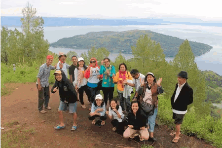 a group of people posing for a picture with one wearing a shirt that says " 2018 "