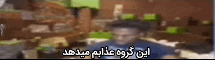 a blurry picture of a man in a hat with arabic writing