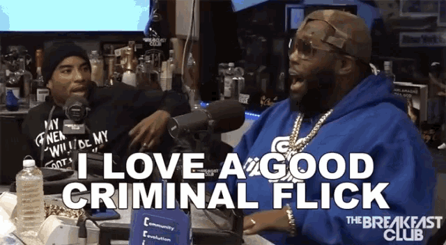 a man talking into a microphone with the words i love a good criminal flick below him