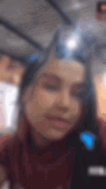 a blurry picture of a woman wearing a bunny ear headband
