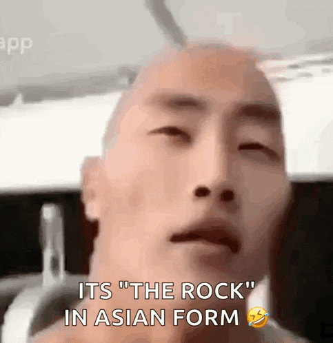 a man with a shaved head says it 's the rock in asian form