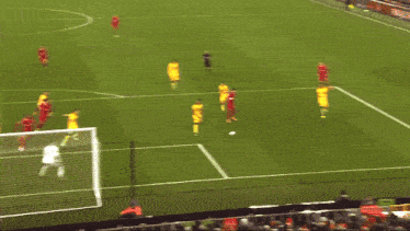 a group of soccer players on a field one of whom is wearing a number 18 jersey