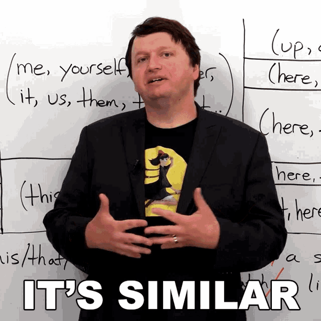 a man standing in front of a white board with the words it 's similar