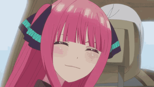 a close up of a pink haired anime character with a ribbon around her head