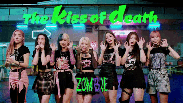 a group of girls are posing in front of a sign that says the kiss of death zombie