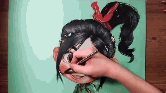 a person is drawing a cartoon character with a brush