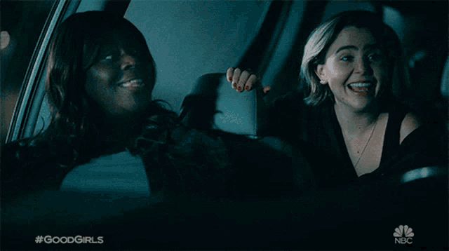 a woman is smiling while sitting in the back seat of a car with #goodgirls written on the bottom