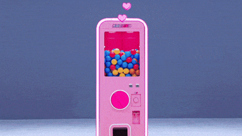 a group of girls are posing for a picture in front of a pink machine that says ' marilyn ' on the top