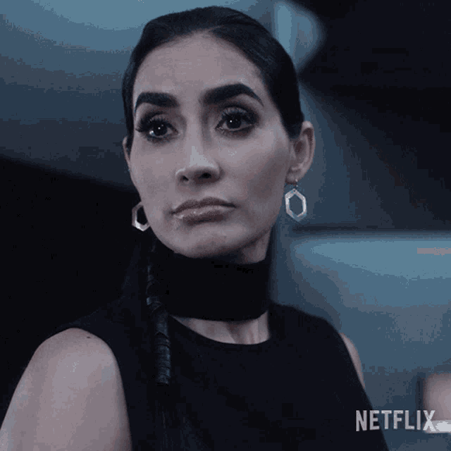 a woman wearing earrings and a choker with netflix written on the bottom