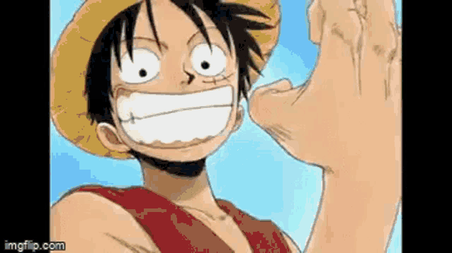 luffy from one piece is smiling and pointing at the camera with his hand .
