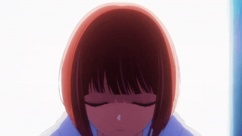a close up of a girl 's head with her eyes closed