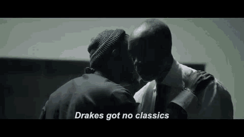 two men are kissing in a dark room and one of them is saying `` drake 's got no classics '' .