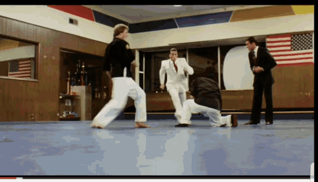 Kick Jean Claude Van Damme GIF - Kick Jean Claude Van Damme White Suit GIFs
