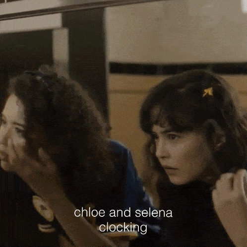 two girls are looking at themselves in a mirror with the words chloe and selena clocking below them