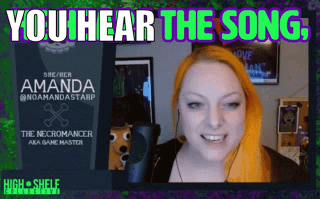 a woman with red hair is smiling in front of a poster that says you hear the song
