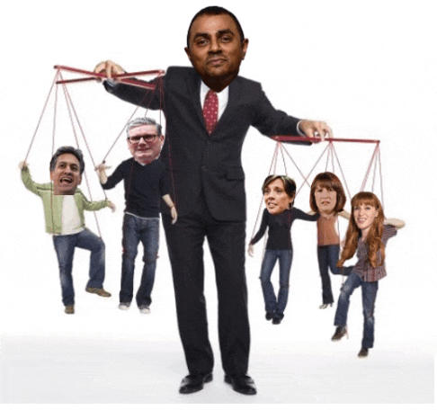 a man in a suit and tie is holding a string puppet of himself