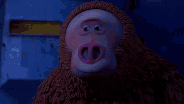 a cartoon monkey with a pink nose is looking at the camera