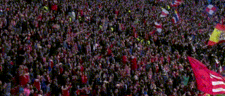 a large crowd of people are gathered in a stadium with flags and a flag that says ' spain '