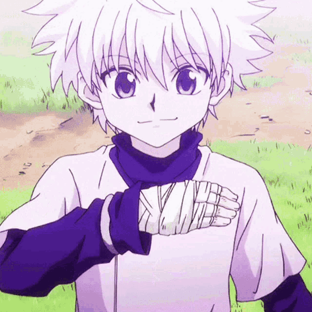 a young boy with white hair and blue eyes is standing in the grass with his hand wrapped in bandages .
